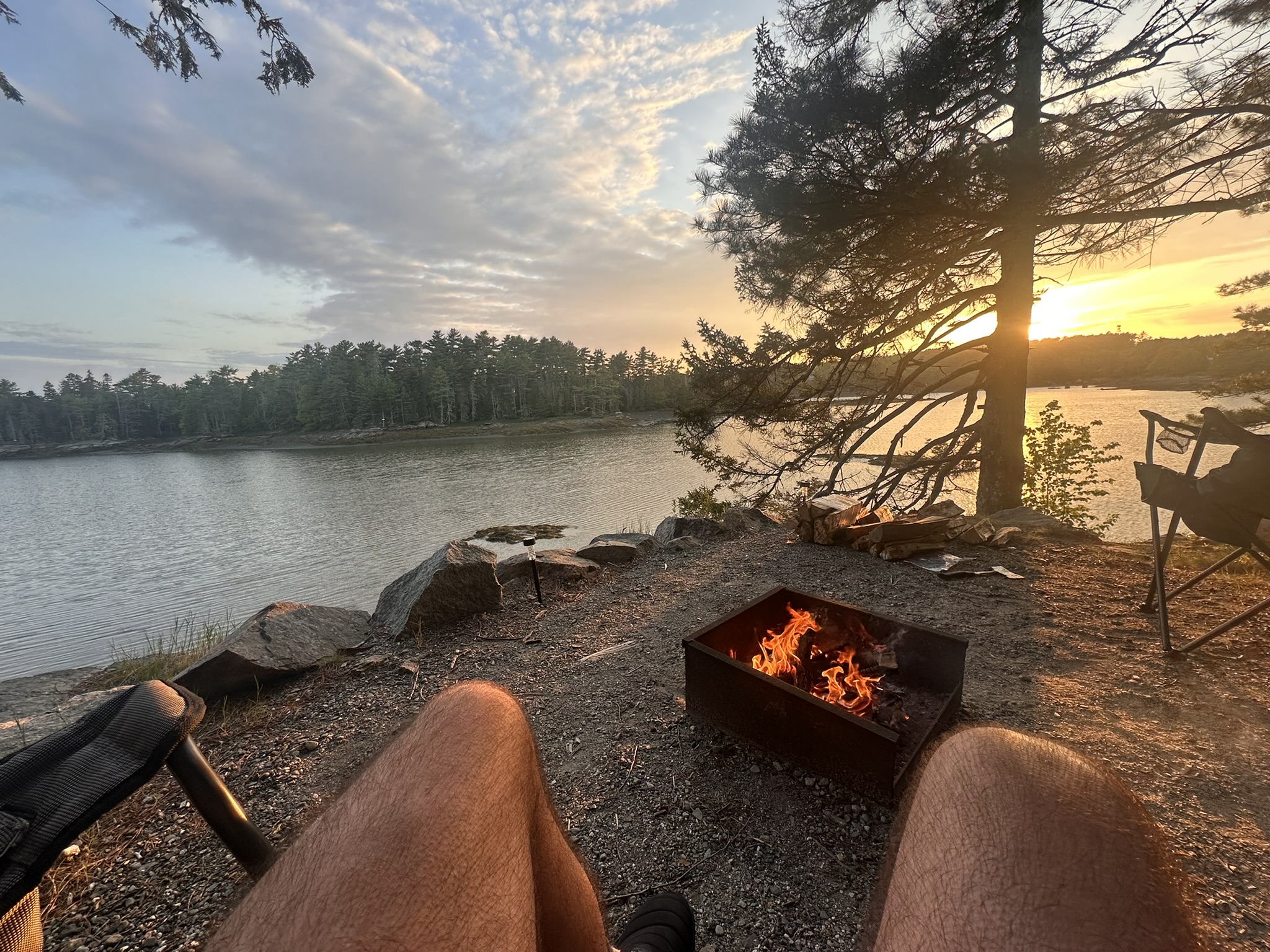 Lakeside campfire at sunset